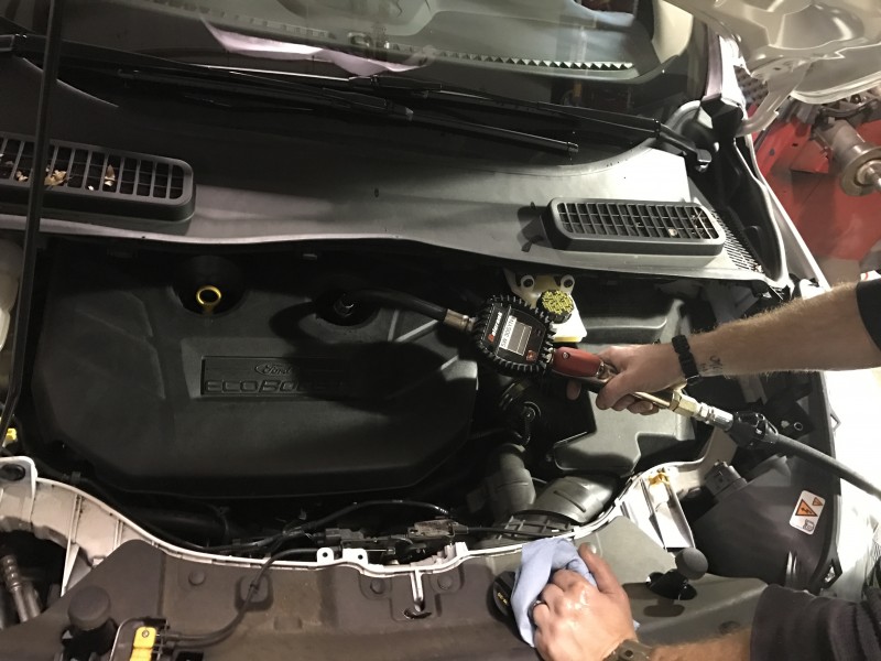Adding oil to engine during oil change