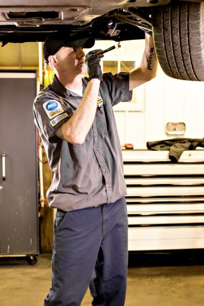 Quality Auto Repair ASE technician working on vehicle